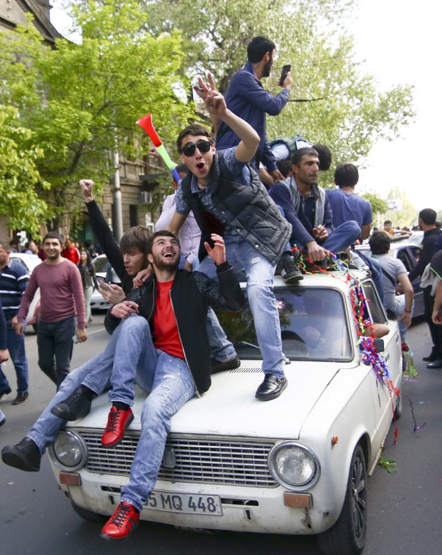 People celebrate Armenian Prime Minister’s Serzh Sargsyan’s resignation in Republic Square in Yerevan, Armenia, Monday, April 23, 2018.