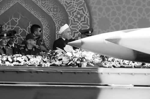 An Iranian Zelzal medium range missile passes by Iranian regime's President Hassan Rouhani