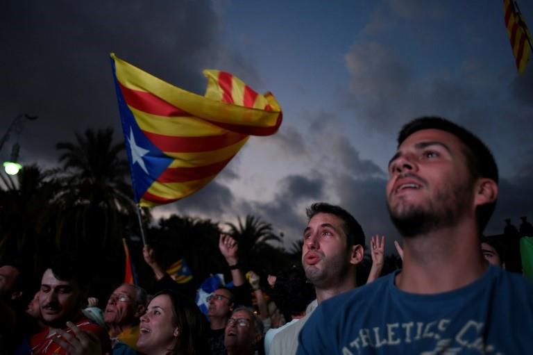 Catalan leader Carles Puigdemont's speech to parliament was watched by crowds on a television screen in Barcelona