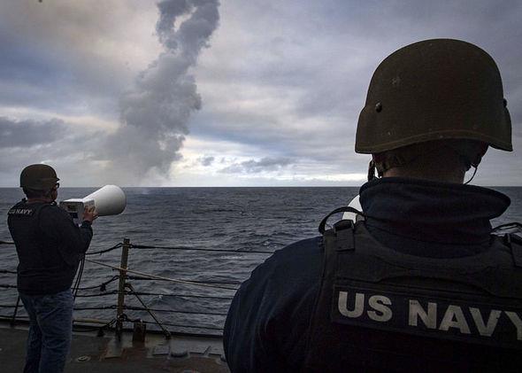 Soldiers watch as combined navies test a missile interception