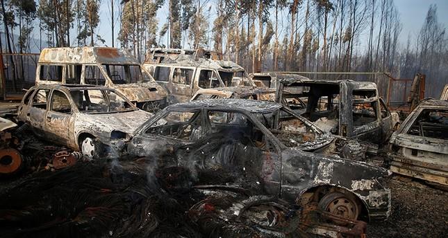  Burnt vehicles are seen after a forest fire in Miro, near Penacova, Portugal