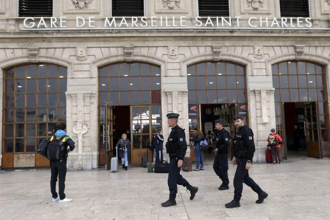Police officers patrol outside Marseille Saint Charles train station, a day after a man fatally