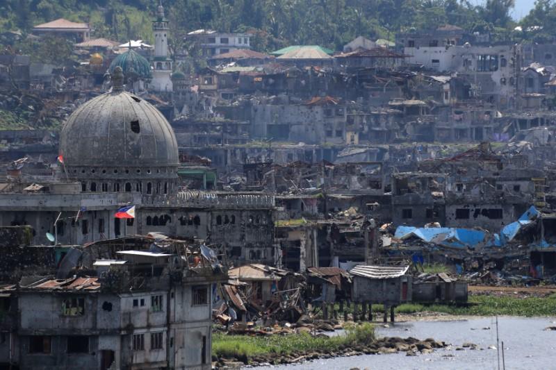 Damaged buildings beside a mosque are seen after government troops cleared the area from pro-Islamic State militant groups inside a war-torn area in Marawi city, southern Philippines October 23, 2017. 