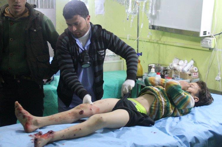 A Syrian child receives treatment at a hospital in Khan Sheikhun after the attack