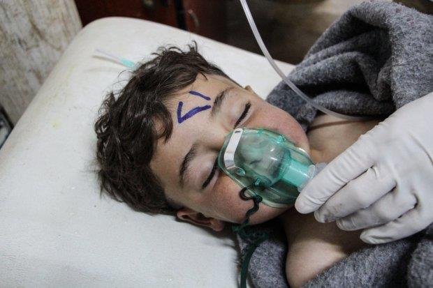 A Syrian child receives treatment