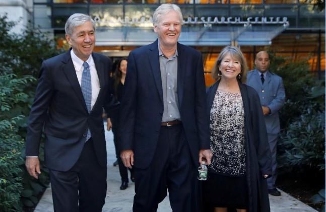 Michael W. Young (C), a joint winner of the 2017 Nobel Prize in Physiology or Medicine, walks to a press conference at The Rockefeller University in New York, U.S., October 2, 2017