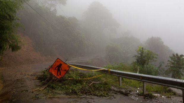 A washed out road in Alajuelita on the outskirts of San Jose, Costa Rica after