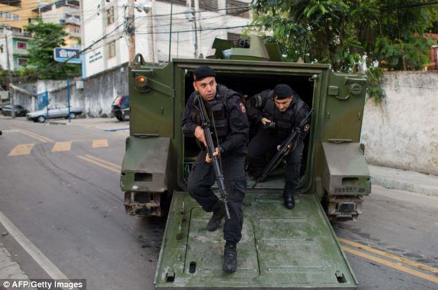 More than 1,000 Brazilian police officers swooped into slum neighborhoods in Rio de Janeiro at the crack of dawn this morning