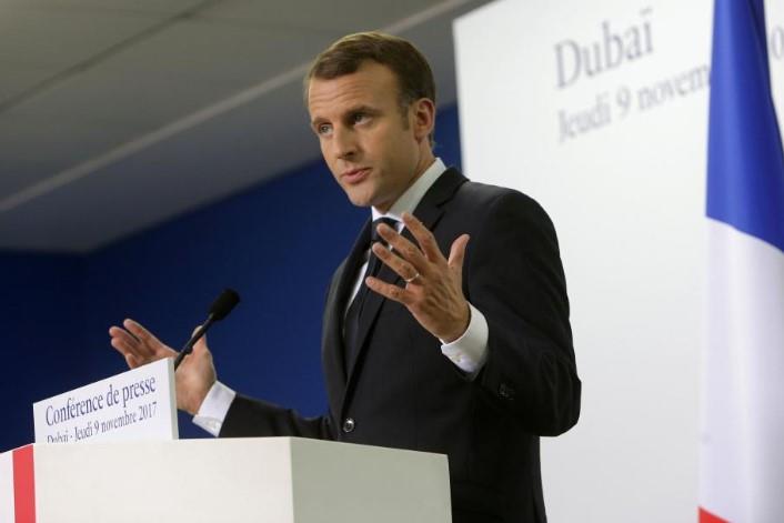French President Emmanuel Macron gestures during a news conference in Dubai, UAE, November 9, 