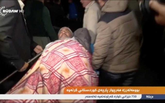 An injured man lies on a stretcher as he is taken to hospital after an earthquake at an unknown location in Iraq in this still image taken from video Nov 13, 2017. Rudaw TV