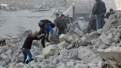 Rescuers search for survivors following a reported air strike on rebel-held Atareb in Syria's Aleppo province on November 13, 2017