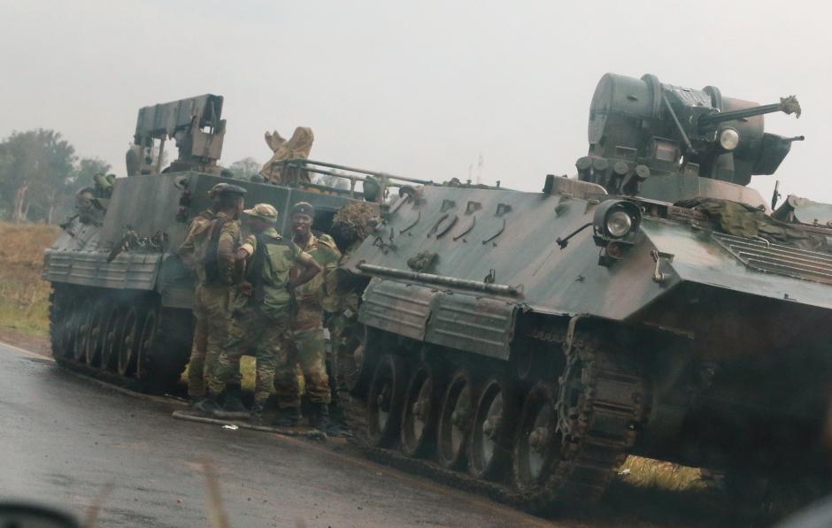 Soldiers stand beside military vehicles just outside Harare,Zimbabwe,November 14,2017