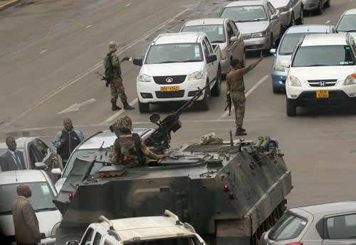 Military vehicles and soldiers patrol the streets in Harare, Zimbabwe, November 15,2017