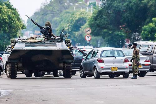 An armoured personnel carrier was seen in the road by an intersection in Harare