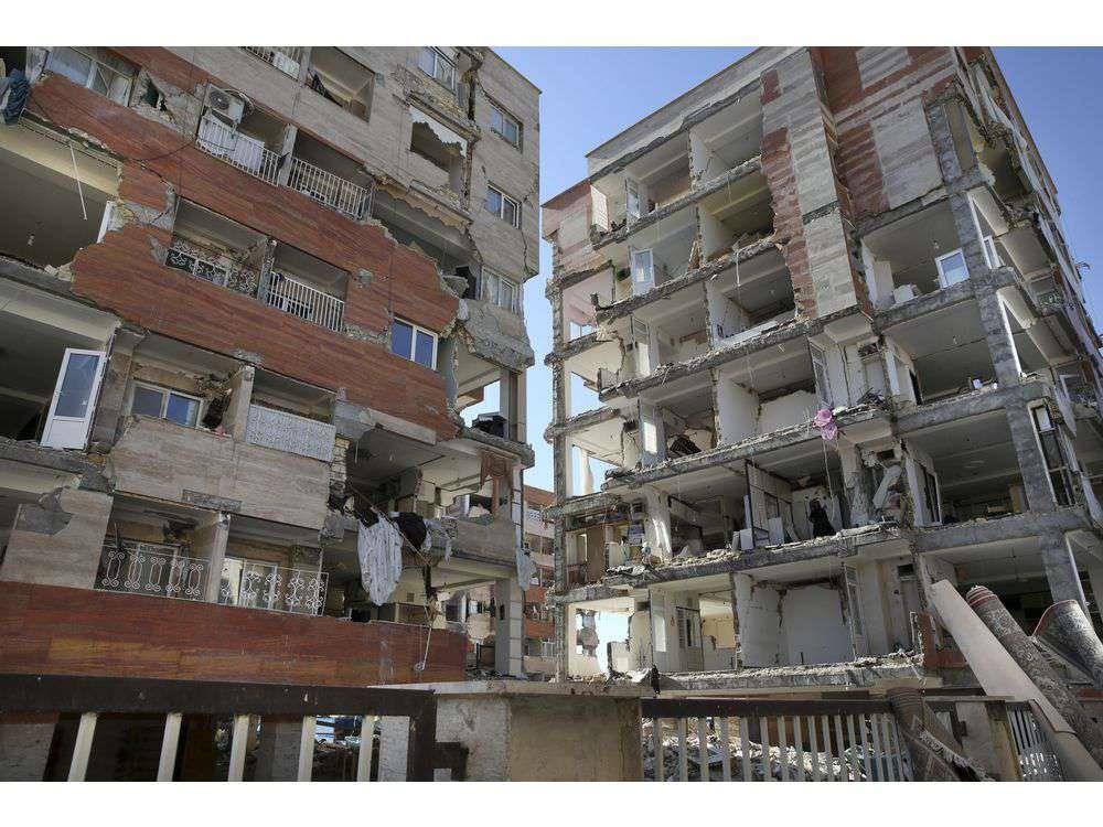 Buildings are damaged by an earthquake in a compound which was built under the Mehr state-owned program, in Sarpol-e-Zahab in western Iran, Tuesday, Nov. 14, 2017. 