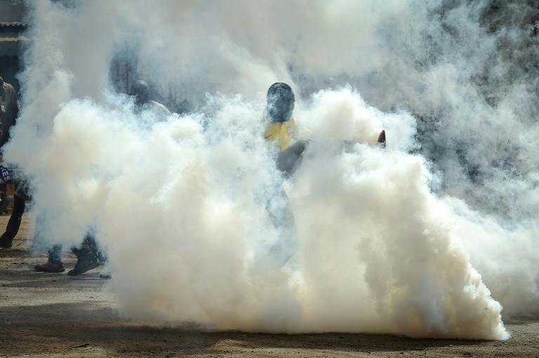 Police fired tear gas to disperse crowds around Odinga's convoy