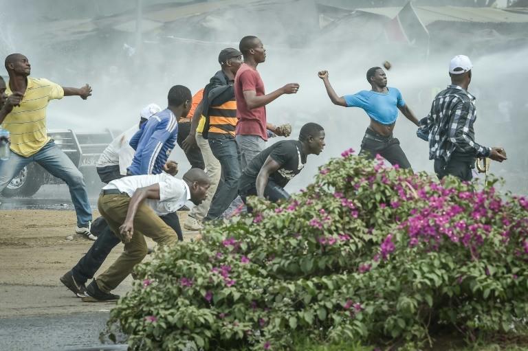  Opposition supporters threw rocks at the police, who used water cannon to break up the crowd