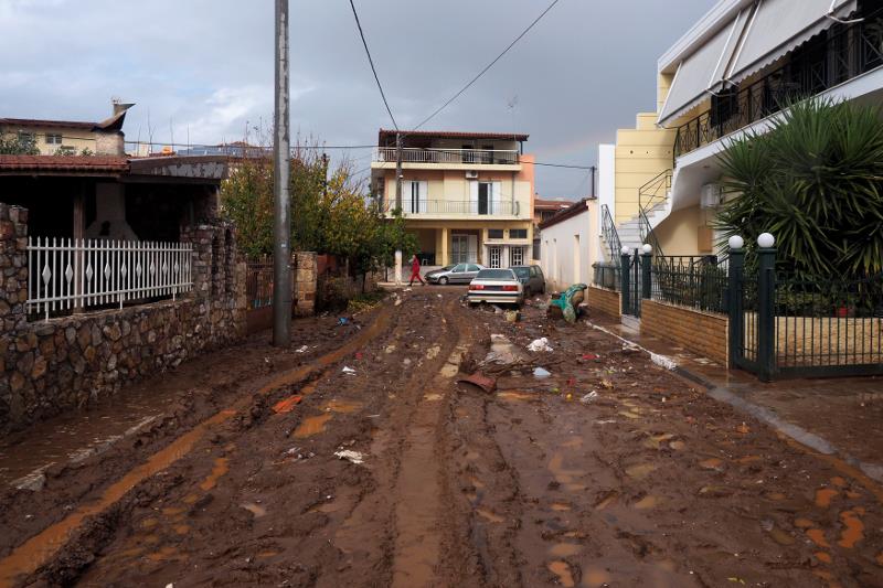 View of a muddy street following flash floods which hit areas west of Athens on November.