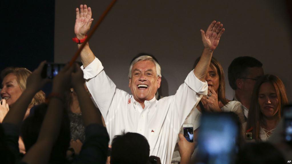  Former Chilean president and billionaire Sebastian Pinera celebrates the first official results that place him first
