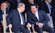 Saad al-Hariri, who announced his resignation as Lebanon's prime minister from Saudi Arabia reacts as he talks with Lebanese President Michel Aoun 
