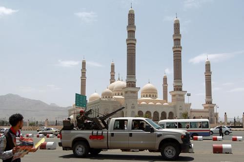 A Yemeni Army vehicle patrols past the al-Saleh mosque in the capital Sanaa on May 21, 2014. 