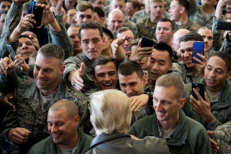 Trump was greeted by dozens of US service members on his arrival