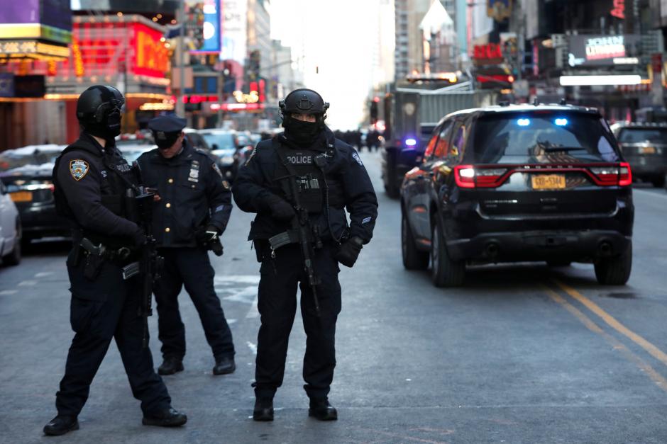 Police officers stand on a closed West 42nd Street near the New York Port Authority Bus Terminal after reports of an explosion in New York City, New York, U.S., December 11, 2017