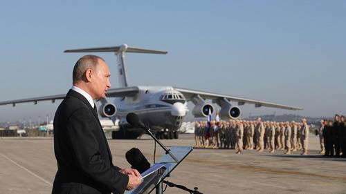 Putin addresses the troops at the Hemeimeem air base in Syria, on Monday, Dec. 11, 2017. 