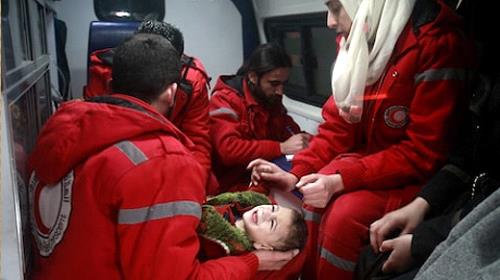 Syrian staff from the International Committee of the Red Cross take part in an evacuation operation in Douma in the eastern Ghouta region on the outskirts of the capital Damascus on December 26 