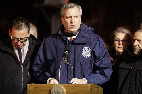 New York City Mayor Bill de Blasio speaks during a news conference after fire crews responded to a building fire on Dec. 28, 2017, in the Bronx borough. 
