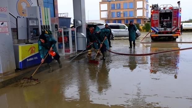 A power company worker died and three others were injured Thursday after torrential rain in Albania flooded