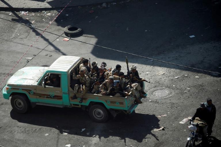 Huthi fighters patrol a street in the Yemeni capital Sanaa on December 3, 2017