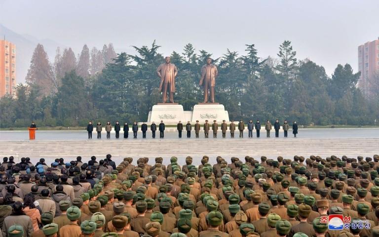 Army and civilians celebrating the successful ICBM test-fire in South Phyongan, North Korea