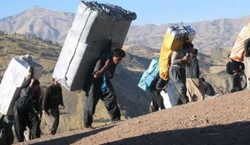 Bent under the weight of their loads -- smuggled cigarettes, alcohol, gasoline, and even home appliances -- the mules are a common sight in Iran's western border regions