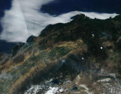 Smoke rises from fires in California in this July 8, 2017, handout satellite image obtained by Reuters July 9, 2017