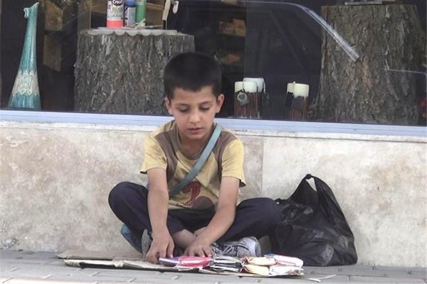  An Iranian child has to grow fast to learn the harshness of the life of povert
