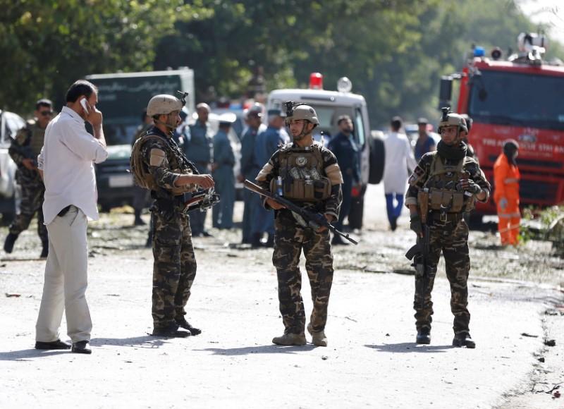 Afghan security forces keep watch at the site of a suicide attack in Kabul, Afghanistan July 24, 2017
