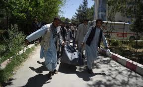  Afghan volunteers carrying the body of a resident killed in a car bomb attack to the Wazir Akbar Khan hospital in Kabul.