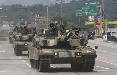 South Korean army K-1 tanks move during the annual exercise in Paju, South Korea, near the border with North Korea