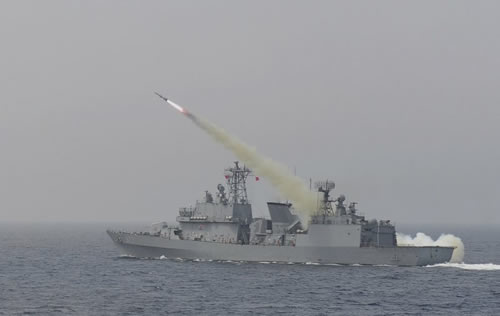 a South Korean navy ship fires a missile