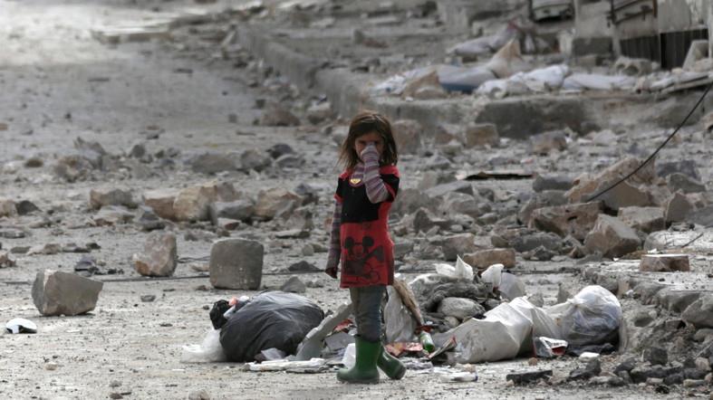 A Syrian child in the ruins of civil war
