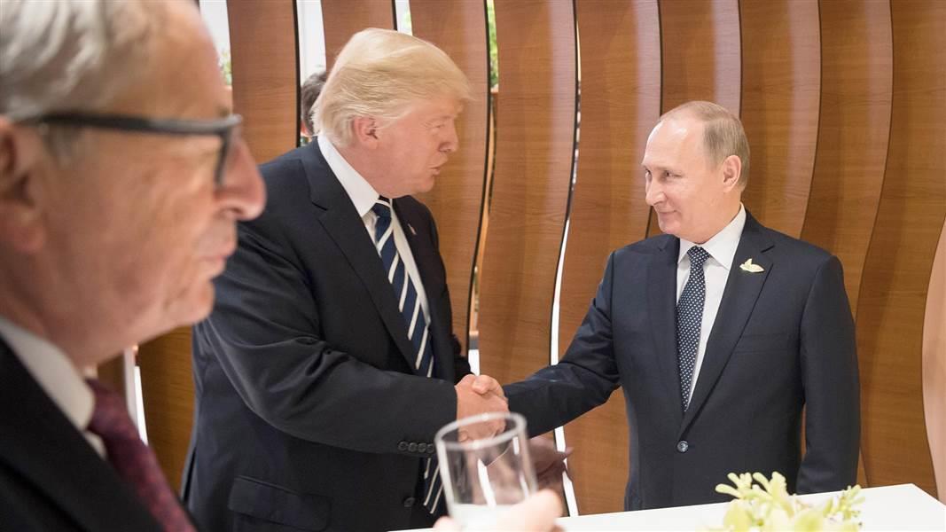 U.S. President Donald Trump shakes hands with Russian President Vladimir Putin during the their bilateral meeting
