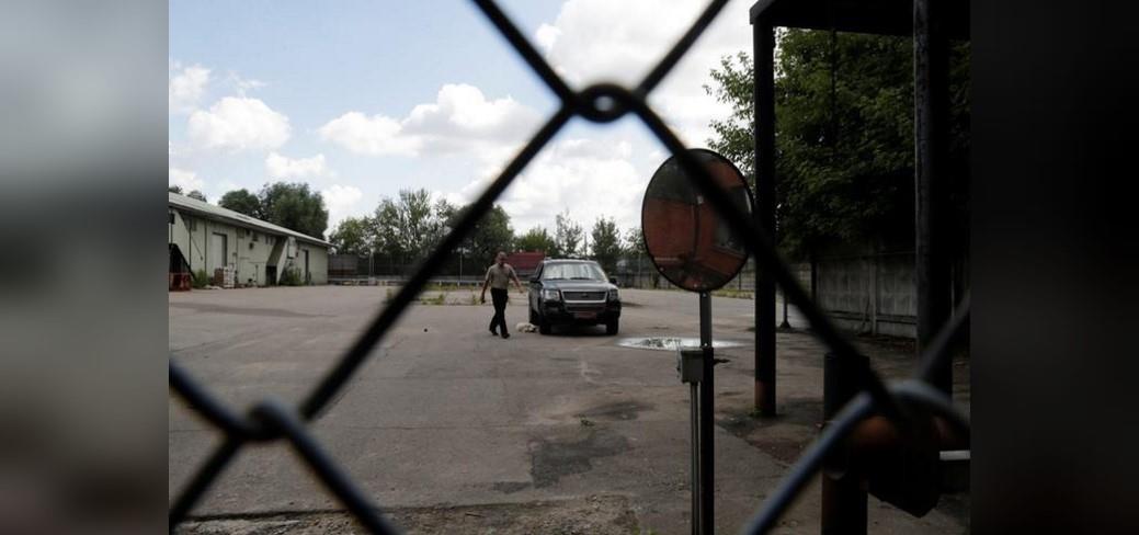 The removal men said they arrived at around 7 a.m. (0400 GMT) and were seen packing furniture, including beds and lamps, into three white removal vans before leaving the property three hours later.