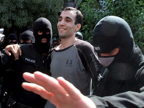 Hoods over the heads of the condemned men were removed before hanging by masked hangmen