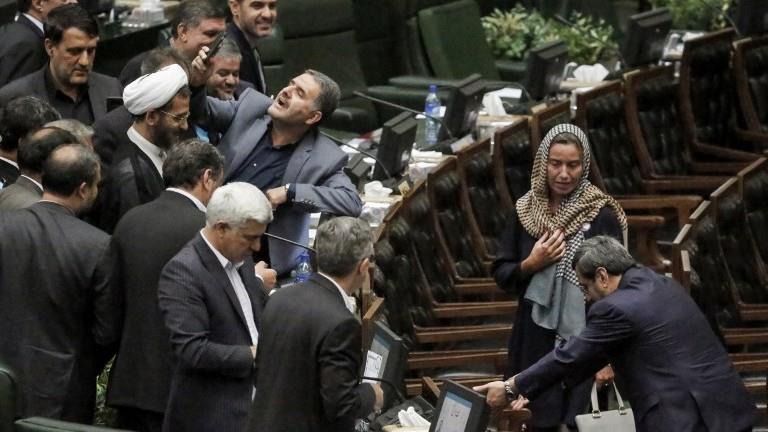 The infatuated scene of Ms. Mogherini surrounded by Iranian MPs to take selfies
