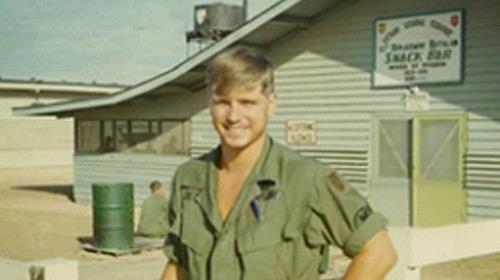 Army Pfc. James McCloughan in front of the Vietnam Regional Exchange Snack Shop, 1969.