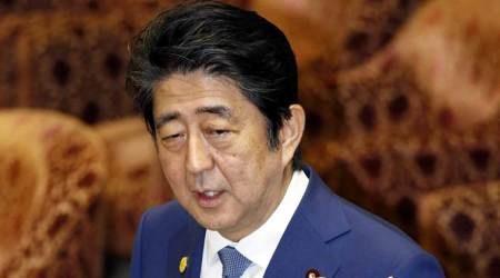 Japan PM Shinzo Abe sends ritual offering to war dead shrine on World War 2 surrender