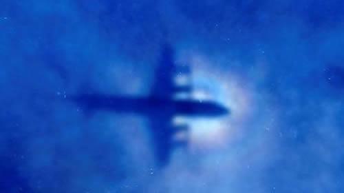 The shadow of a Royal New Zealand Air Force (RNZAF) P3 Orion maritime search aircraft can be seen on low-level clouds as it flies over the southern Indian Ocean looking for missing Malaysian Airlines flight MH370 March 31, 2014.