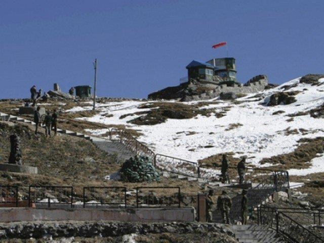 Indian army soldiers are seen after a snowfall at the India-China trade route