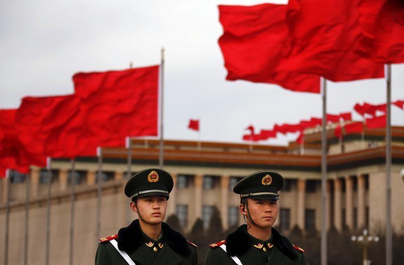  ... guard on the Tiananmen Square near the Great Hall of the People during the closing ceremony of the Chinese People's Political Consultative Conference ...